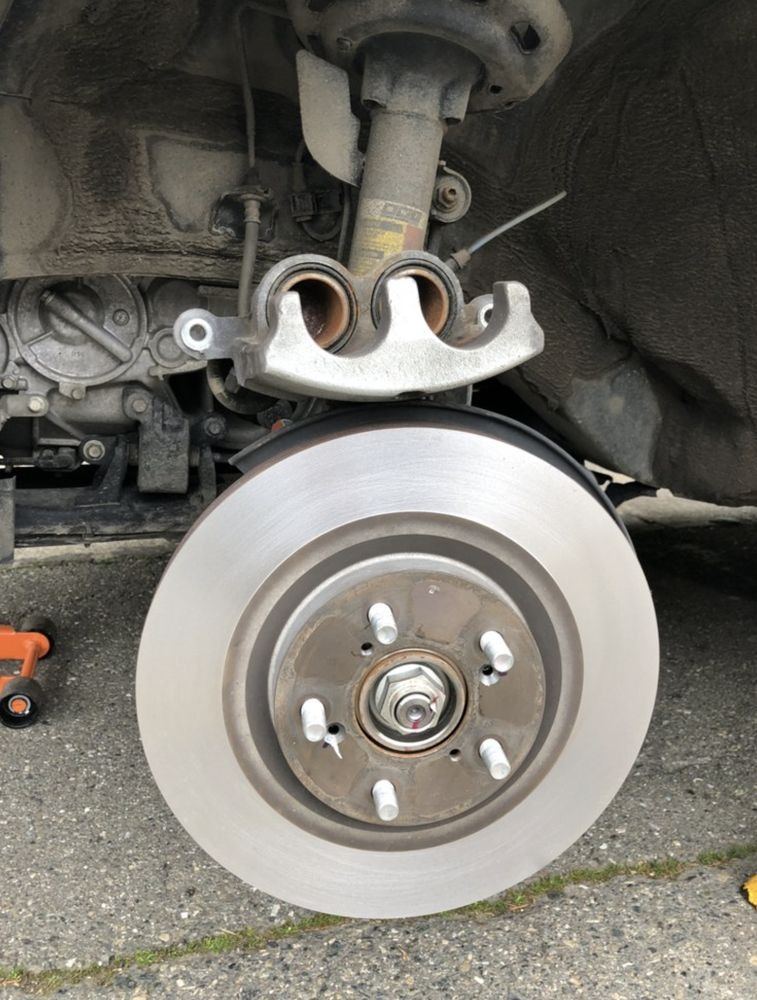 New rotor installed at an Erie driveway brake job